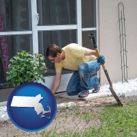 a landscape contractor working on a landscaping project - with MA icon